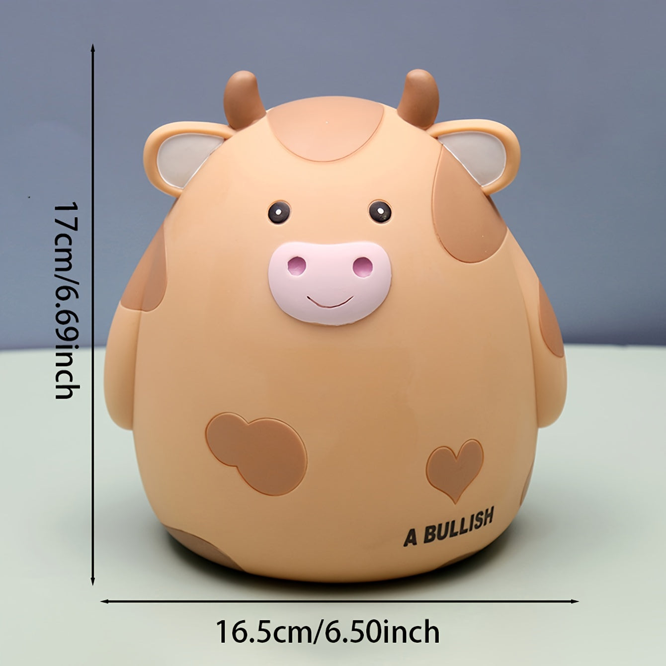 Cute cow-shaped penny bank, perfect for saving money and as a creative gift for birthdays and Christmas. Made of non-waterproof PVC with latch closure, ideal for desk decor.