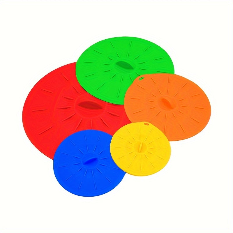 A collection of 5 durable silicone lids that are perfect for covering bowls, cups, plates, pots, pans, and more. These versatile covers can be used in the microwave, stovetop, oven, fridge, and freezer. They are BPA-free and come in various sizes to suit