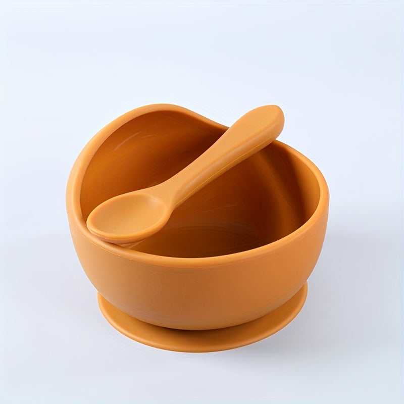 1 set of 2 pieces silicone bowl and spoon for children, featuring a suction cup for anti-slip use. This set is perfect for serving complementary foods and training little ones to eat independently. The set also includes a silicone straw for added