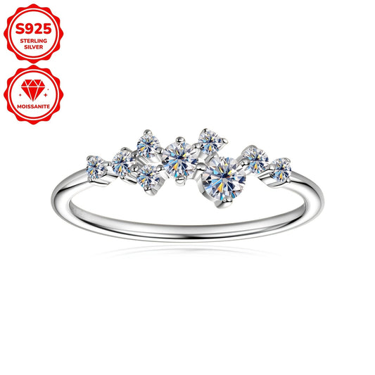 This delicate and stylish engagement ring for women is made of 925 silver and adorned with synthetic Moissanite stones. The ring features one 3mm stone, one 2.5mm stone, two 1.8mm stones, and five 1.6mm stones, totaling 0.3 carats. It is perfect for