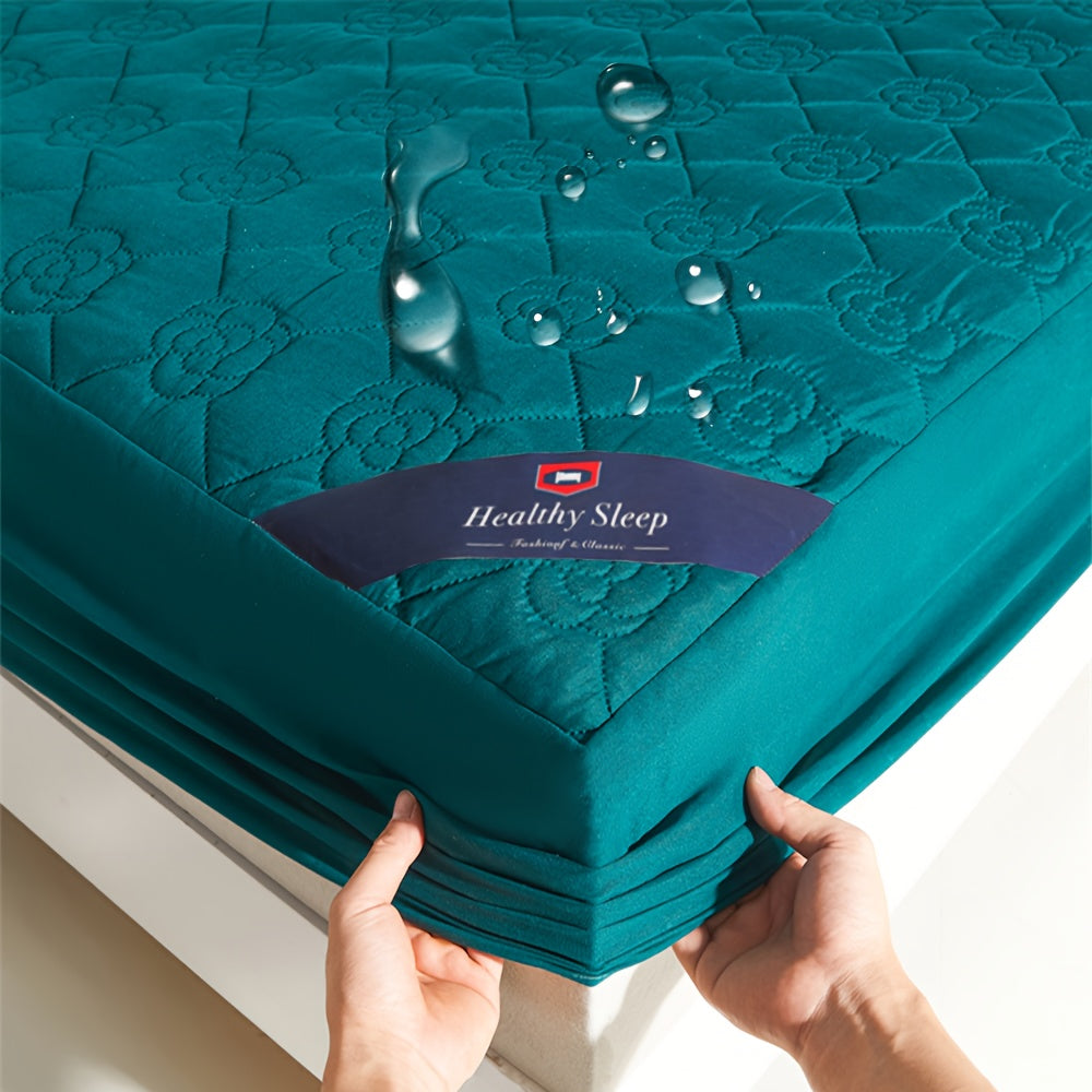 Waterproof mattress protector with soft and breathable soundwave technology fitted sheet in teal green with floral quilted design. Perfect for bedrooms, hotels, and dorm rooms. Made of