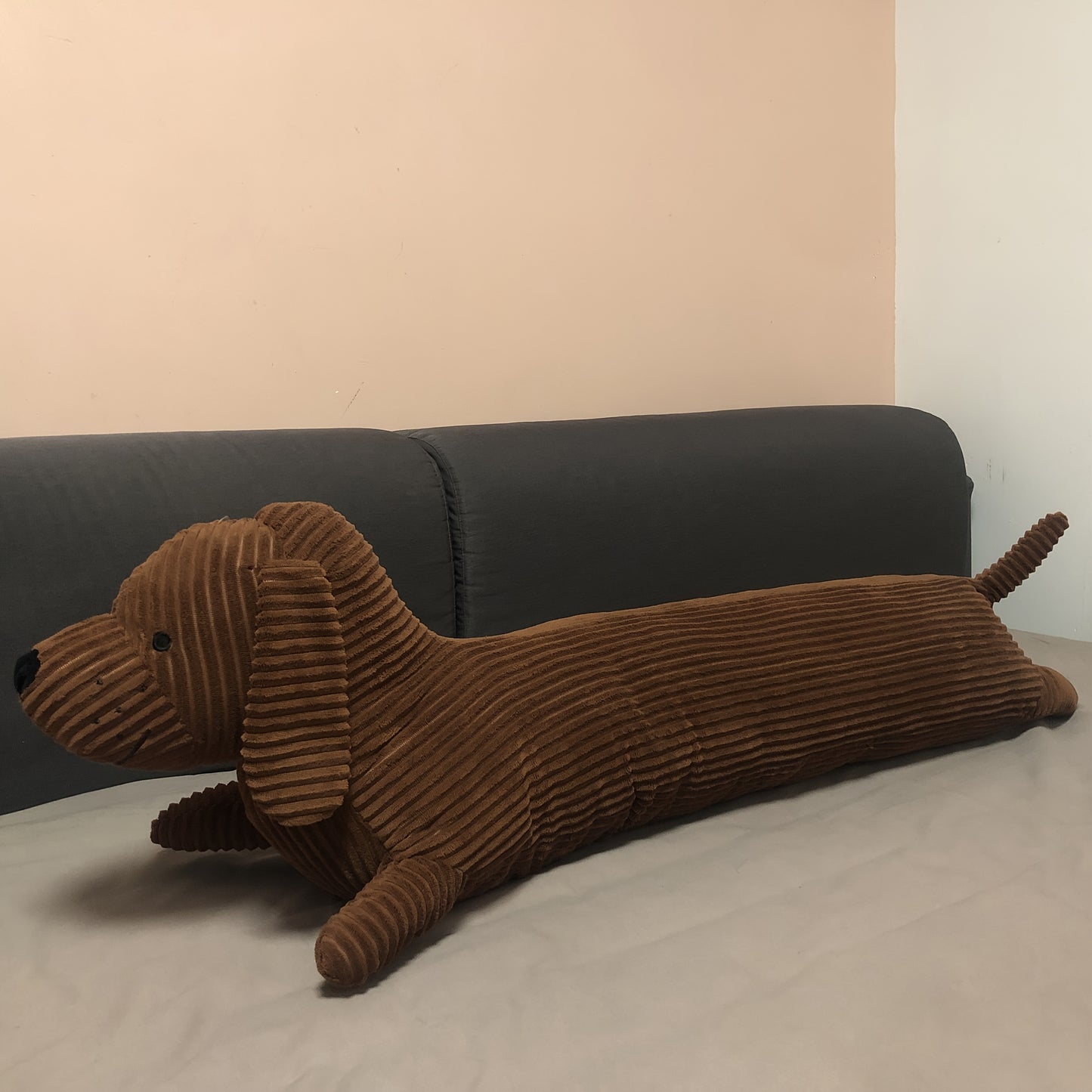 Soft, washable Dachshund dog plush pillow provides neck and waist support for lunch breaks.