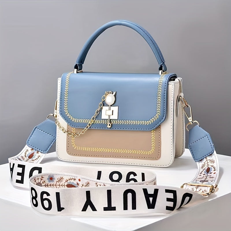 Stylish two-tone women's handbag with adjustable printed strap, made of PU material.