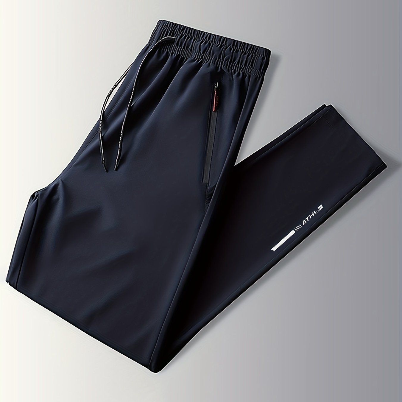 Men's track pants with zipper pockets for outdoor activities gifted.