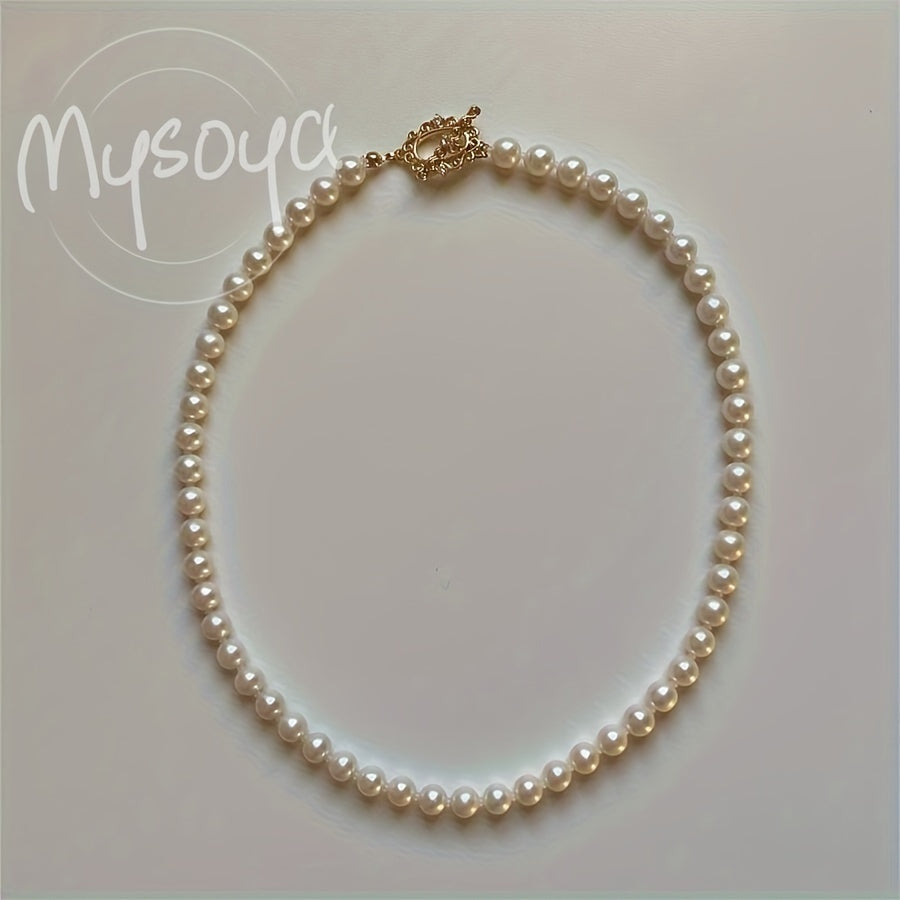 Enhance your look with the MYSOYA Elegant Handmade Freshwater Pearl Necklace. Featuring 5-6mm white pearls with a vintage OT clasp, this exquisite piece is perfect for weddings and daily wear. Presented in a chic gift box, it makes an ideal gift for