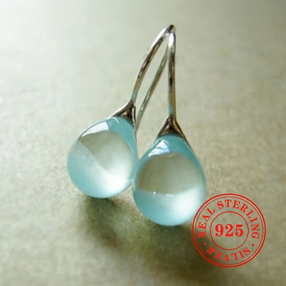 These elegant earrings for women are a stunning addition to any outfit. Crafted from high-quality S925 sterling silver and featuring faux sea blue gemstone pendants, these stylish dangly earrings weigh 3.3 grams. Perfect for weddings and other special