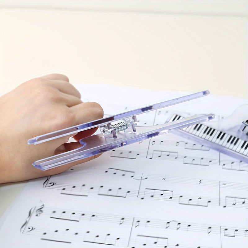 Stylish and durable transparent piano sheet music clips with staff notation. Perfect for organizing piano scores and sheet music. Available in black and clear options. Secure sheet grip.