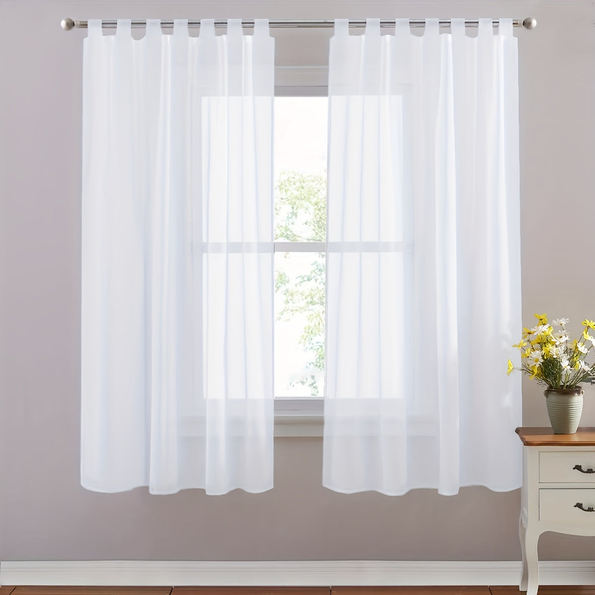 Set of 2 lightweight solid white sheer curtains with tab tops, perfect for bedroom, living room, and dining room. Includes 2 pieces.