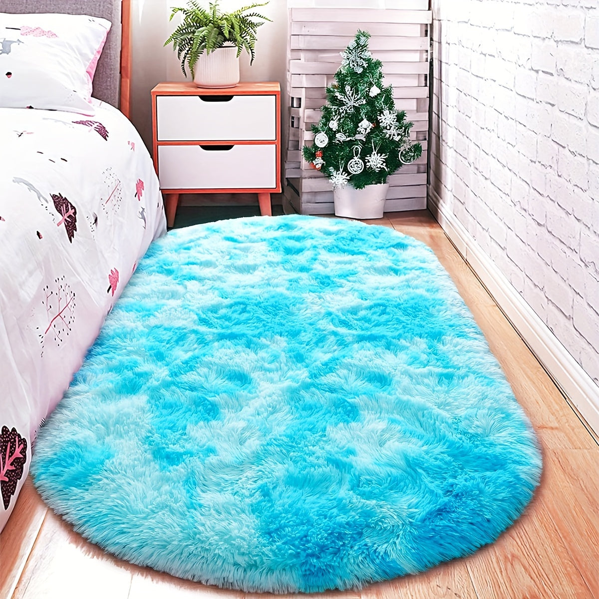 Soft and fluffy oval shaggy area rug, perfect for bedroom or living room. Made with skin-friendly thickened sponge and tufted polyester material. Durable and easy to maintain. Adds decorative touch to indoor spaces such as sofa, bedside, playroom, or