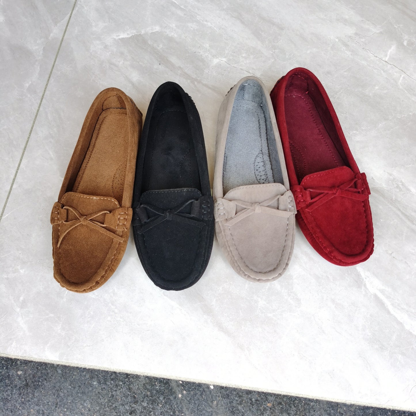 Retro flat loafers with bow detail, slip on style, and soft sole for casual wear.