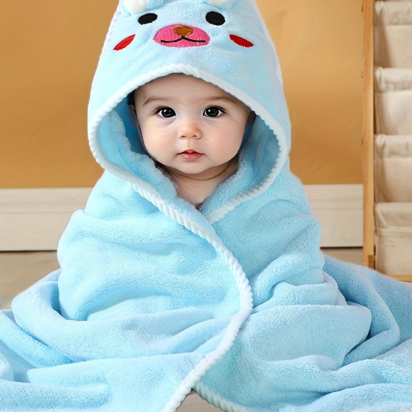 Multi-functional and highly absorbent hooded bathrobe with animal pattern for babies, ideal for swimming, beach, or bathing.