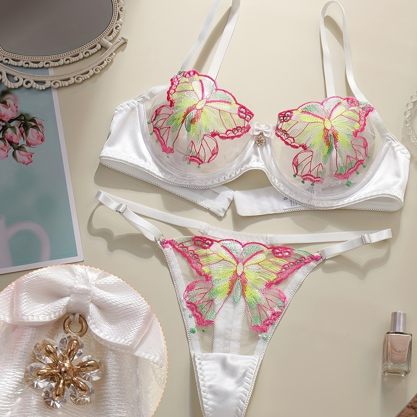 Sophisticated butterfly lingerie set with sheer mesh and embroidered details, includes underwire bra and thong in breathable fabric, hand washable.