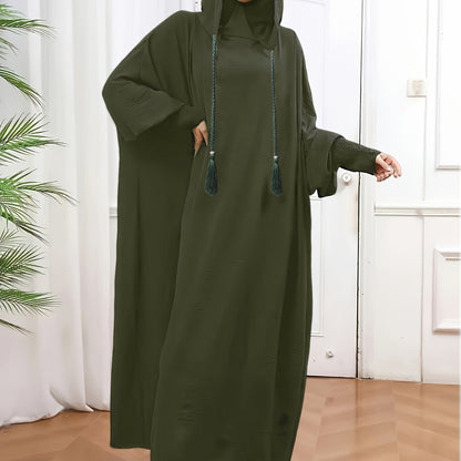 Elegant black abaya with batwing sleeves, drawstring hood, and loose fit. Versatile minimalist style for all seasons. Made of polyester.