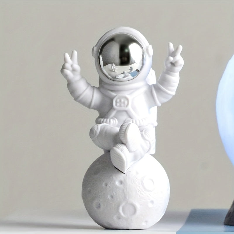 Chic astronaut figurine set with golden egg decor - perfect for home or office; great birthday gift for space enthusiasts.