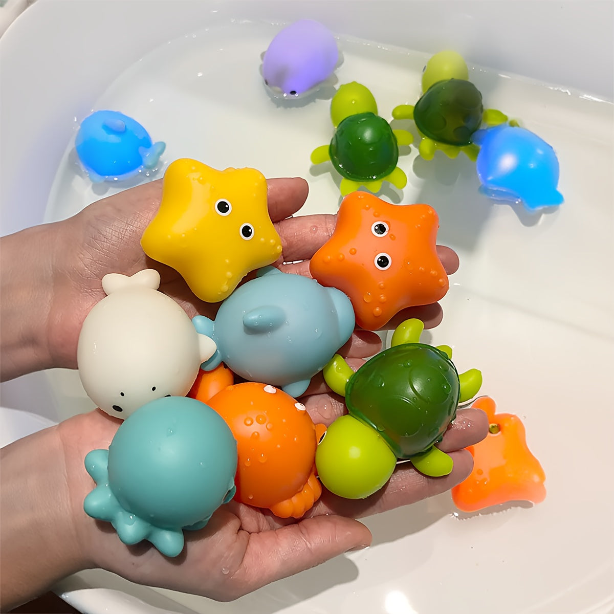 Colorful glow-in-the-dark bath toy set of luminous ocean animals made of PVC, with batteries included. Fun and educational bathtub game for youngsters.