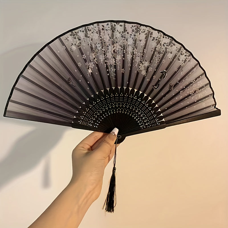 Asian-inspired bamboo hand fan with plant design - perfect for home decor, dance, or as a gift.