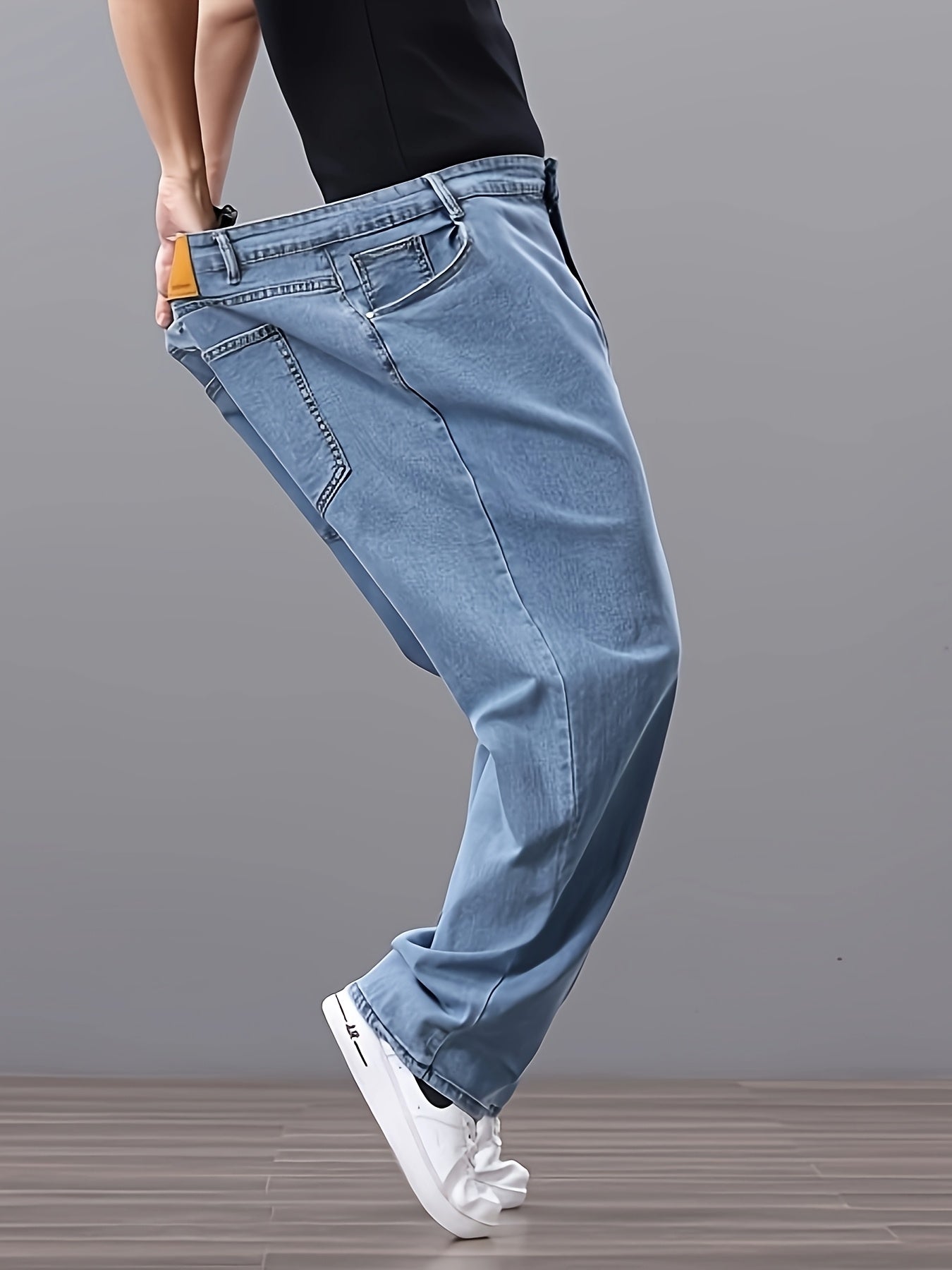 Men's high-waisted denim jeans with stretch fit in a solid color. Features regular fit, straight leg, and made of 45% cotton, 33% polyester, 1.5% spandex, 20.5% rayon. Lightweight at