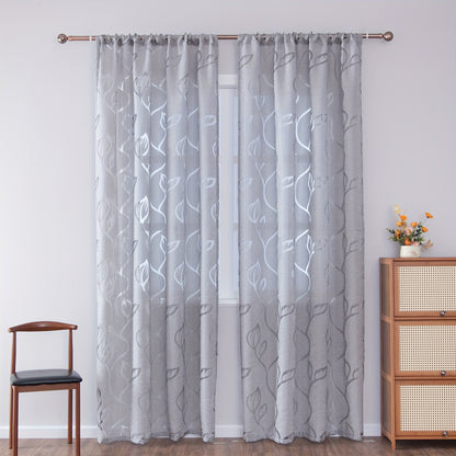 Elegant and contemporary gray floral sheer curtain with a rod pocket design, perfect for enhancing the decor of your living room, bedroom, or home.