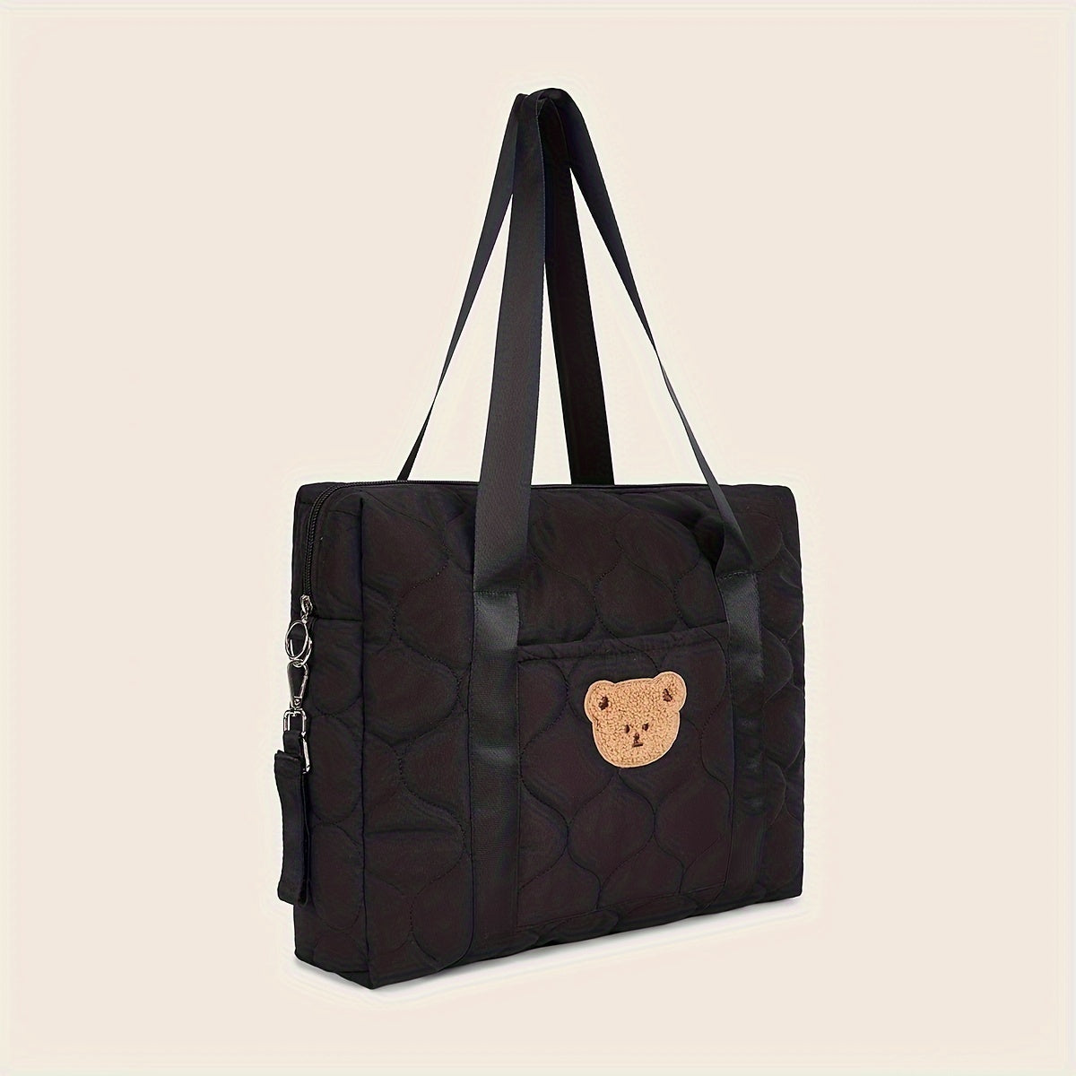 Large black parent bag with ample storage space, perfect for taking on the go. Features a shoulder strap for easy carrying.