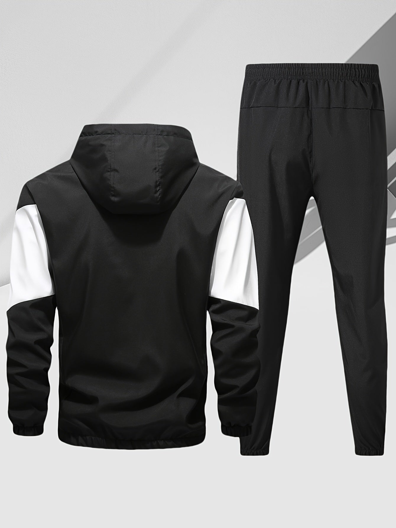 Men's casual 2-piece outfit with a stylish color block zip up hooded jacket and breathable drawstring pants.