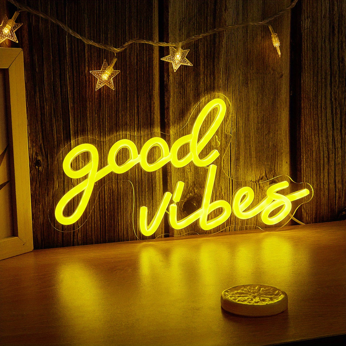 Pink cursive "Good Vibes" LED neon sign, USB powered for wall decor in bedroom, bar, or party atmosphere.