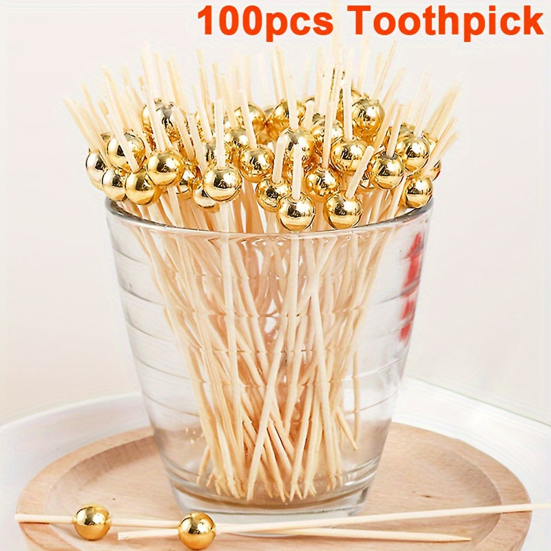 100 pieces of golden, pink, and white pearl bamboo toothpicks for weddings and parties, ideal for appetizers, fruits, and beverages on special occasions. Great for cakes, desserts, and cupcakes.