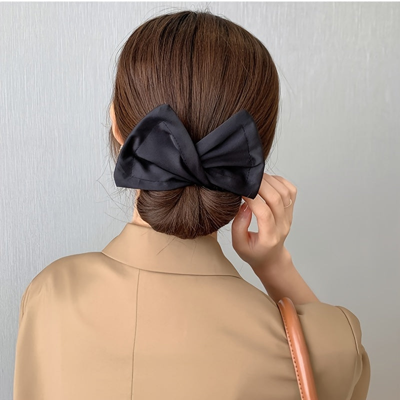 Bow shaped ponytail holder for creating lazy hair curls and buns, a fashionable women's hair accessory.