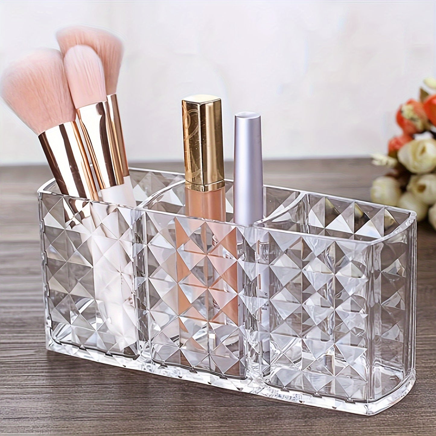 Clear plastic makeup organizer with 3 compartments for cosmetic storage. Ideal for brushes, lipsticks, brow pencils, and remote control. Can be used as a vanity or desk organizer without electricity.