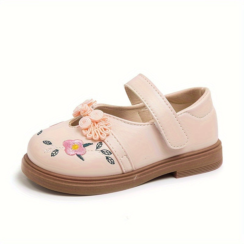 Girls' Mary Jane shoes with floral accents, soft non-slip sole for babies and toddlers.