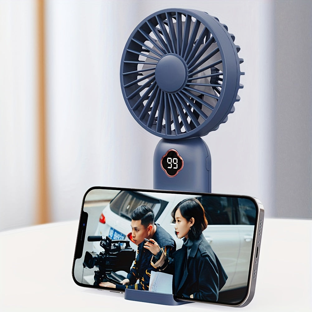 Essential for the summer season, this handheld mini fan with a 1200mAH battery pack is perfect for staying cool during outdoor activities. Measuring 19.71*8.99cm, this silent small fan is a must-have for back-to-school supplies, RV trips, camping