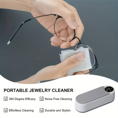 Ultrasonic cleaning machine with rechargeable lithium battery and vibrational stain removal technology for glasses, jewelry, watches, and dental retainers.