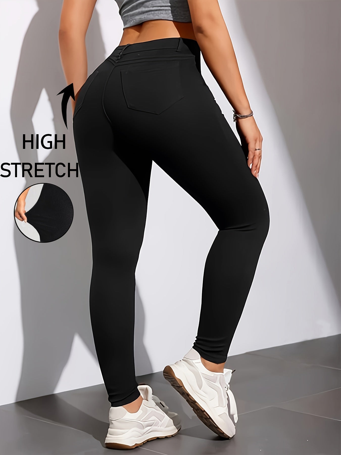 High-waist, skinny jeans in chic black with casual stretch denim, solid color, long length, trapeze hem, and zipper fly. Suitable for all seasons.