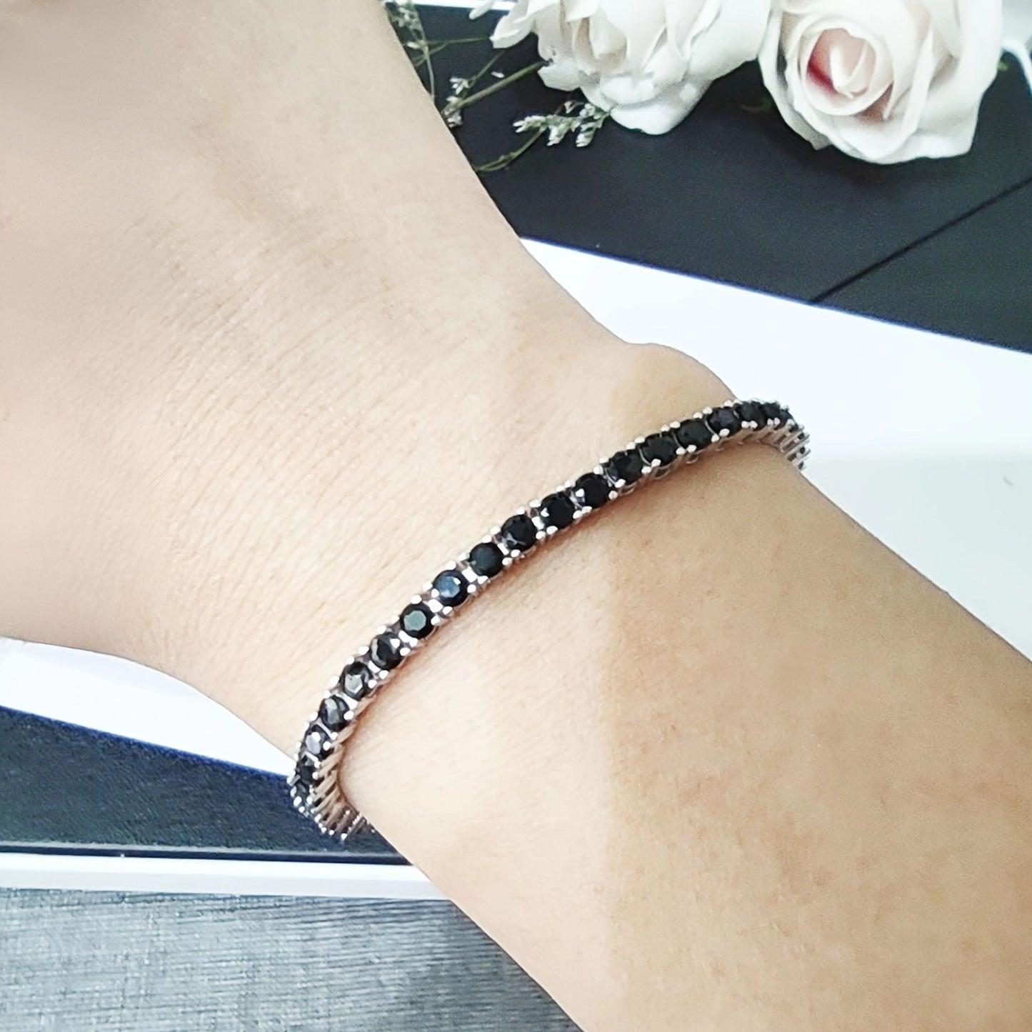 Add a touch of elegance to your outfit with the stunning S925 Sterling Silver Black Moissanite Bracelet featuring a 1.0CT single stone. This luxurious fashion accessory is perfect for parties and dates, making it an ideal gift for Halloween, Christmas