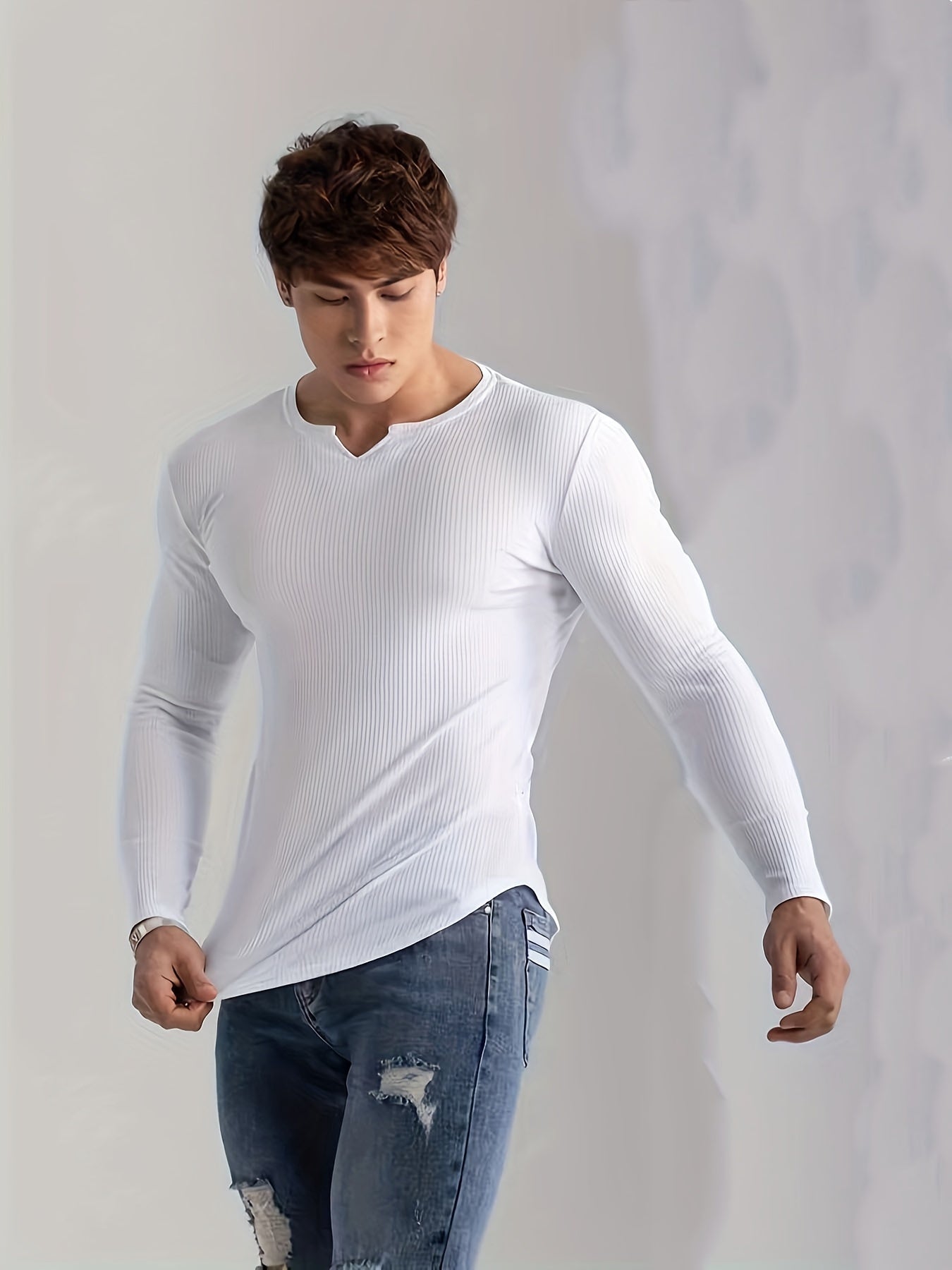 Men's solid color long sleeve V-neck t-shirt for comfortable and casual wear in spring and fall outdoor activities.