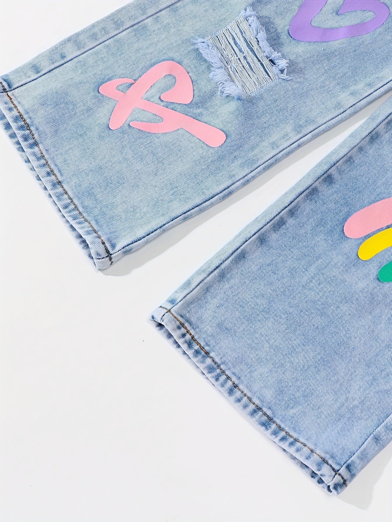 Y2K-inspired straight-leg jeans for girls with elastic waist. Features heart and flower designs, rainbow accents. Comfy, non-stretch denim. Perfect for school, skateboarding, and