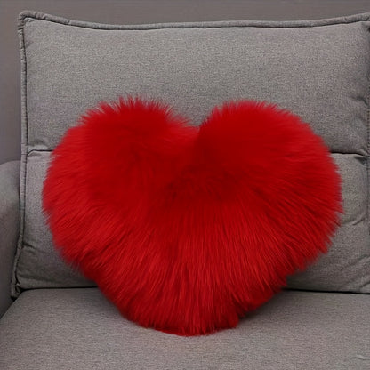 Heart-shaped throw pillow for living room or bedroom, made of long plush material for softness and comfort.