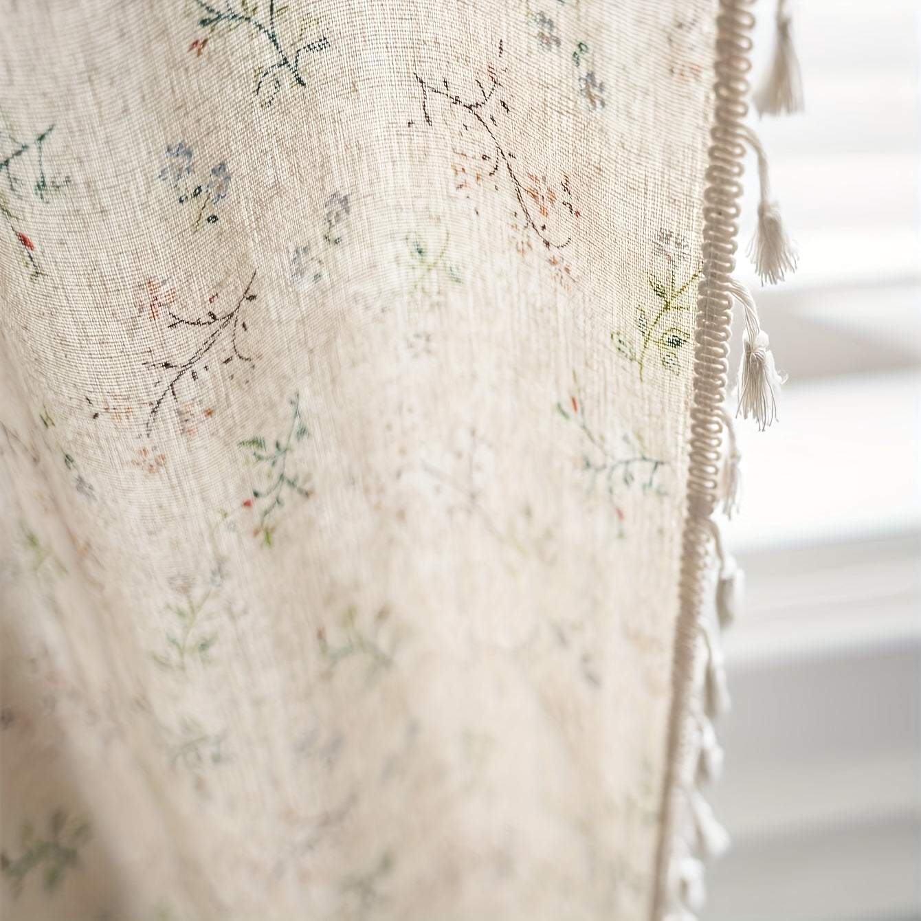 Bohemian floral milk-white and linen print curtain with semi-shading features, perfect for various spaces such as living room, bedroom, classroom, office, bay window, dining room, or kitchen. The curtain has a rod pocket design with beige fringe for