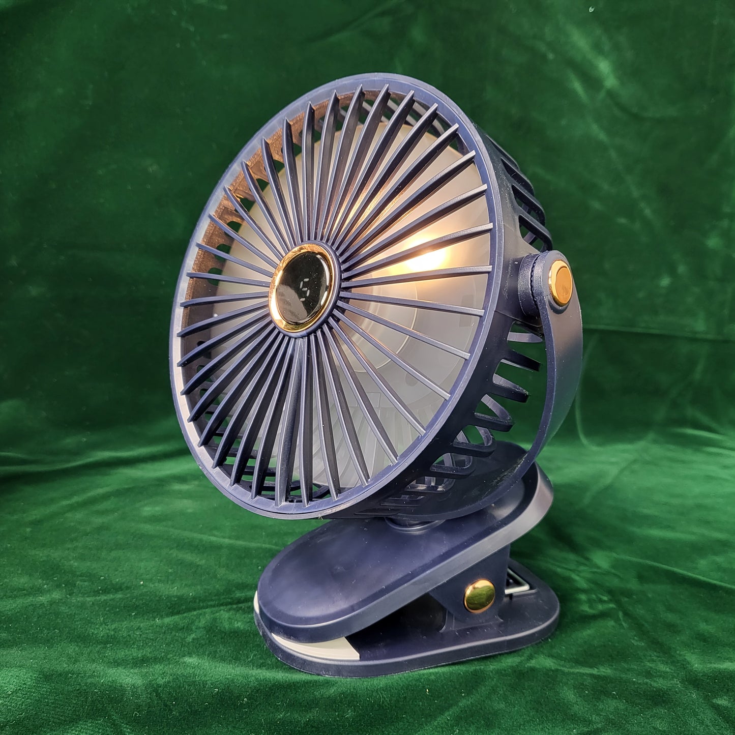 Black Portable Clip-On Fan with 360° Rotatable design is perfect for various settings such as outdoor camping, golf carts, strollers, and home offices. This silent mini table fan offers 5-speed settings and features a built-in lithium battery with