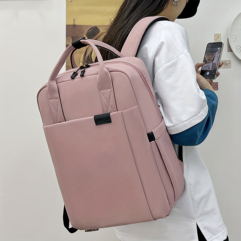 Spacious 39.62cm laptop backpack for men and women, shockproof and water-resistant with pink polyester material. Features practical pockets, cartoon animal design, perfect for high school