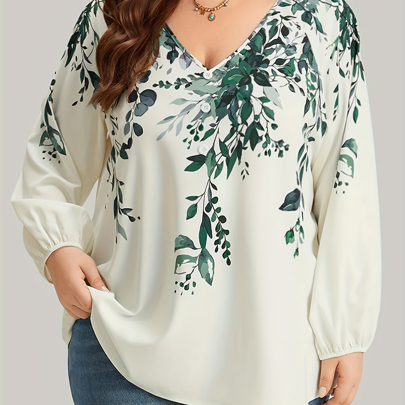 Floral print plus size blouse with V neck and long sleeves for spring. Women's plus size clothing.