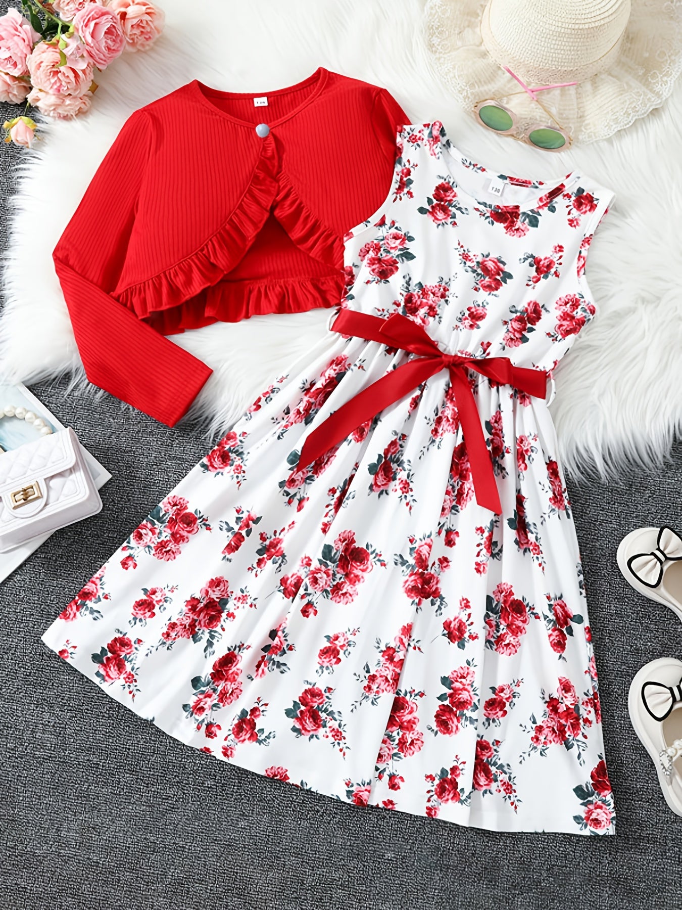 2-piece girls' spring/fall dress set with floral umbrella skirt and crew neck knit top. Made of 100% polyester, features long sleeve ruffle hem and button detail. Great for daily wear and