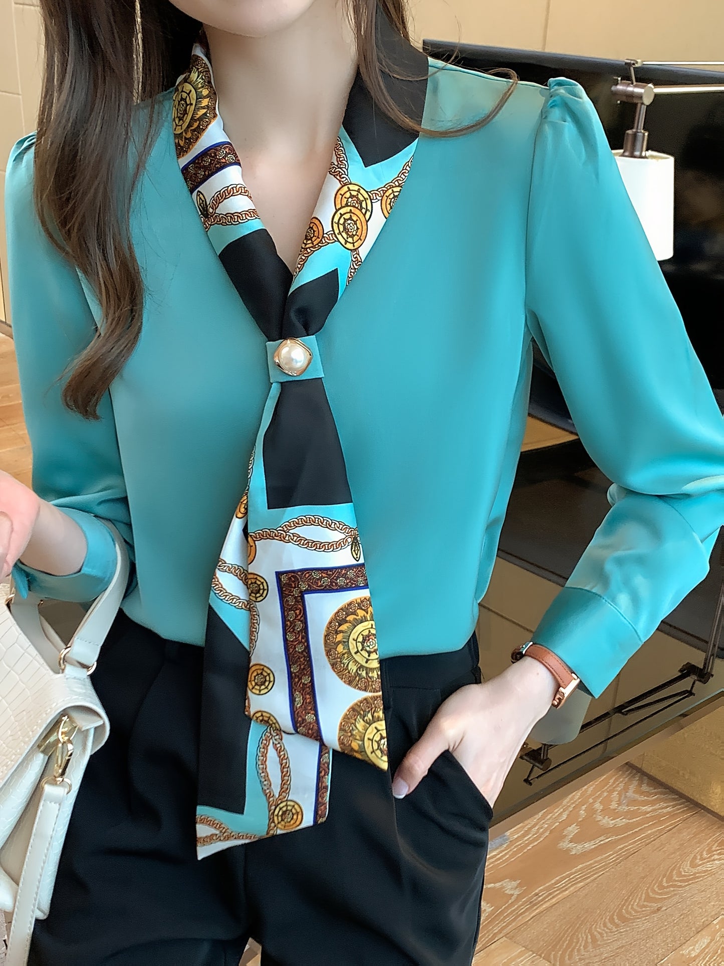 Polyester tie neck blouse with long sleeves, button detail print for women. Regular fit woven top, fashionable all-season style.