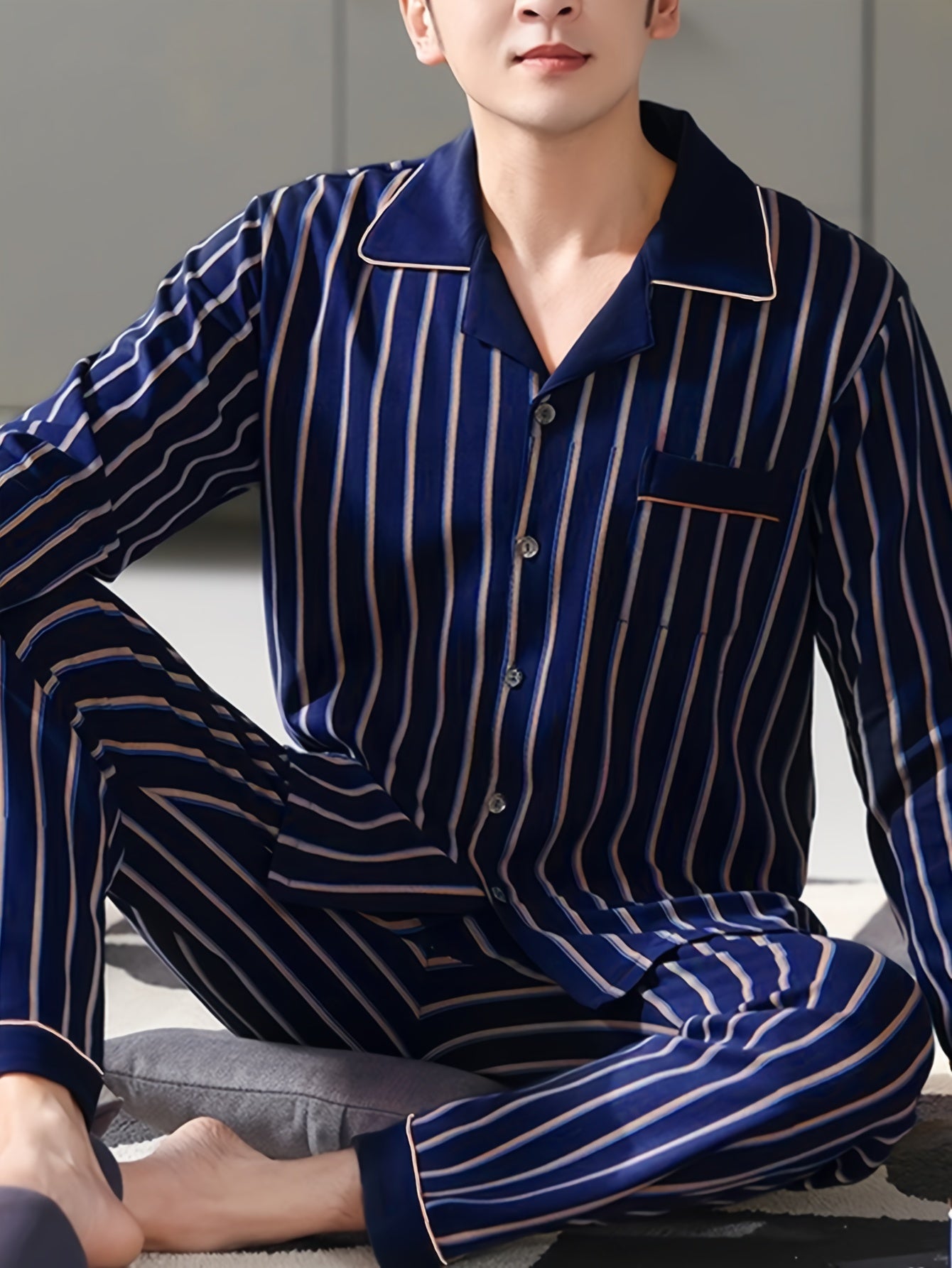 Men's long sleeve pajama set by QIANNIANMA, striped, made of polyester and elastane blend, machine washable, with pockets. Suitable for spring/autumn sleepwear and home wear. Features brand