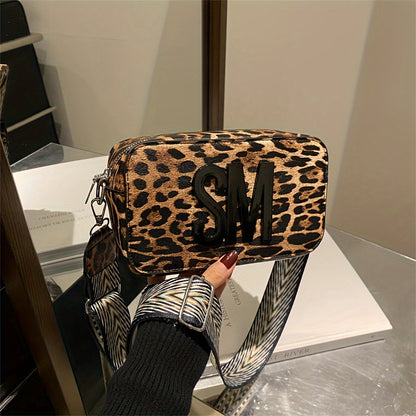 Leopard print PU crossbody bag with detachable strap in deep brown, perfect for casual or commuting outfits. Bold letter design on small shoulder bag.