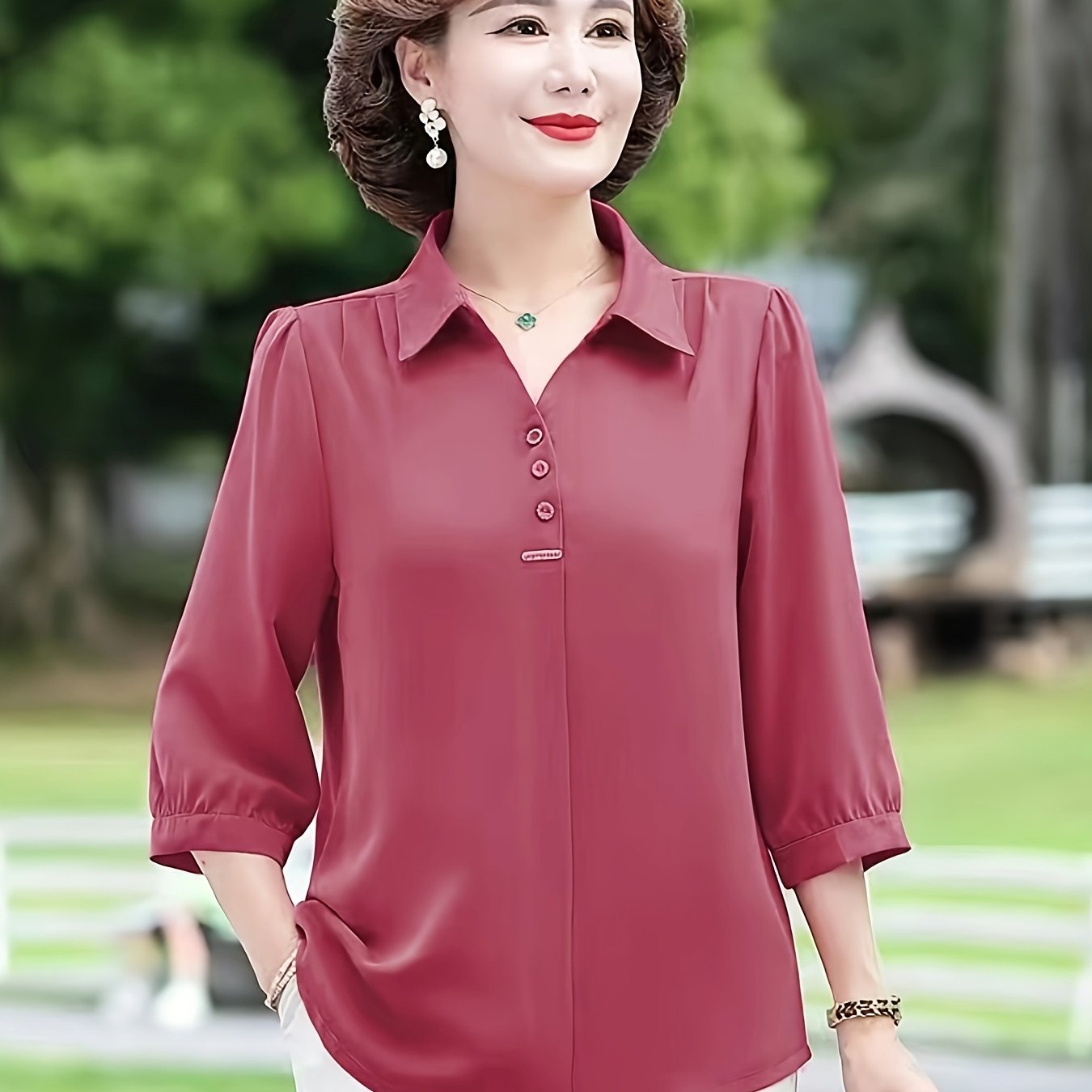 Stylish purple chiffon blouse for women with 3/4 sleeves, slimming fit, and decorative buttons. Made of lightweight polyester-elastane blend, perfect for spring, summer, and fall. Features