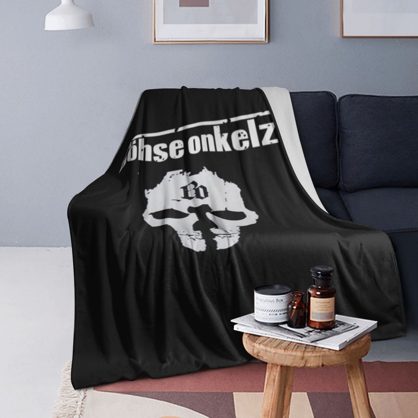 Stay warm and cozy with the Bohse Onkelz Band Pattern Flannel Throw Blanket. Featuring a contemporary style and digital print, this soft and warm blanket is crafted with knitted craftsmanship and made from polyester. Perfect for use on the sofa, bed