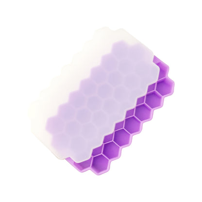 The Silicone Honeycomb Ice Tray is designed with 37 compartments and a lid for easy storage. Made of durable silicone, this tray is perfect for creating hexagonal ice cubes and can also be used for making chocolate, wax bottles, and candy. The flexible