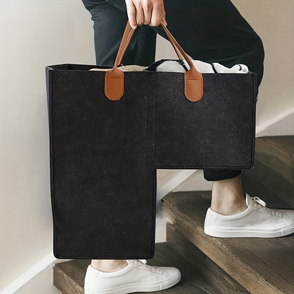 Felt storage basket with leather handles, foldable open top for organizing clothes and toys at home.