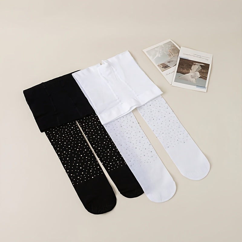 2 pairs of black and white rhinestone-studded tights for baby girls.