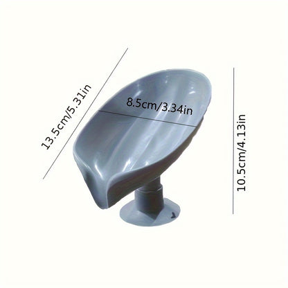 Suction cup soap dish with drainage for home organization and storage, suitable for kitchen and bathroom use.